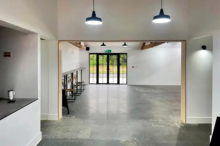 Open-plan interior with new doors and lighting