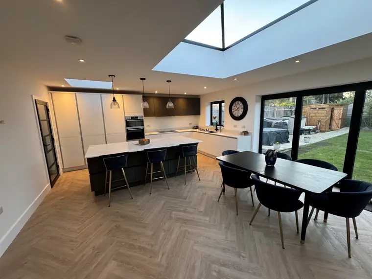 Open-plan kitchen with island and roof lantern