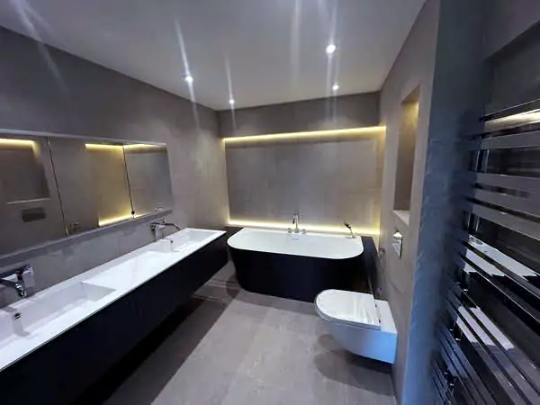 Bathroom with double basin and heated towel rail